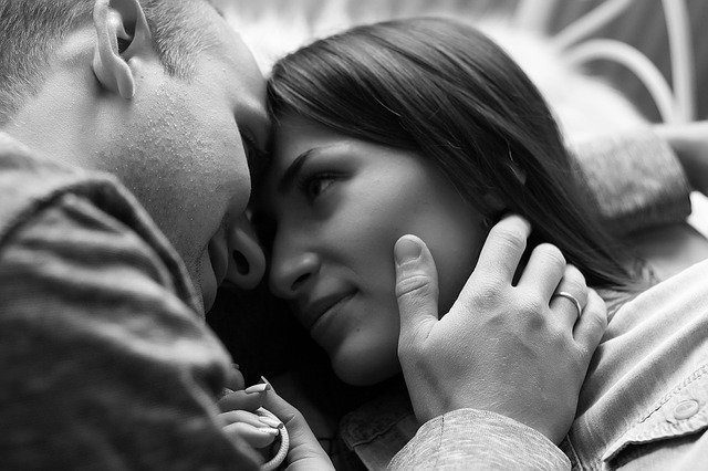 man and woman kissing